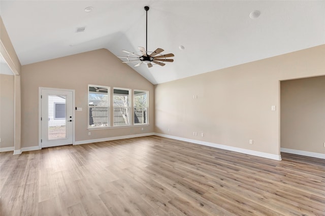 unfurnished living room with ceiling fan, light hardwood / wood-style floors, and vaulted ceiling