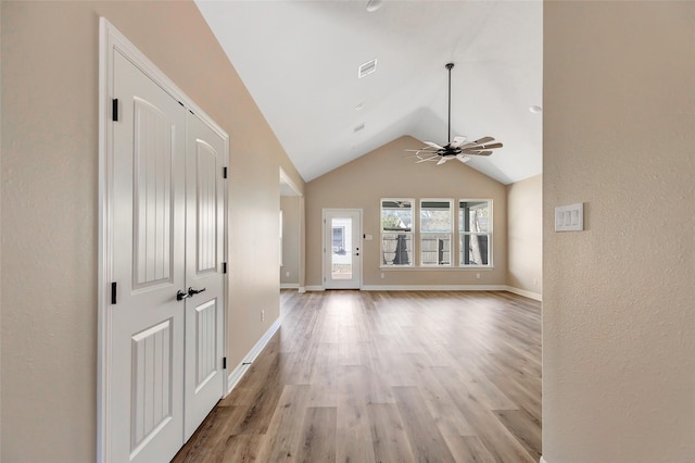 interior space with vaulted ceiling and light wood-type flooring