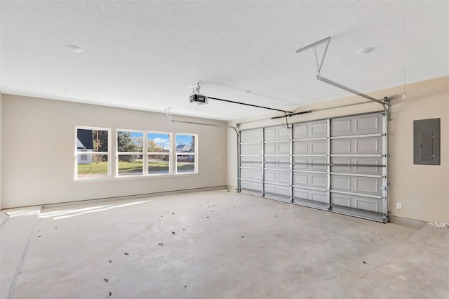 garage featuring electric panel and a garage door opener