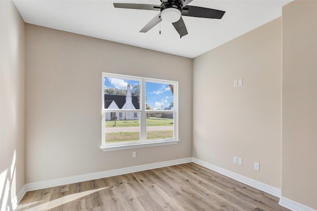 spare room with ceiling fan and light hardwood / wood-style flooring