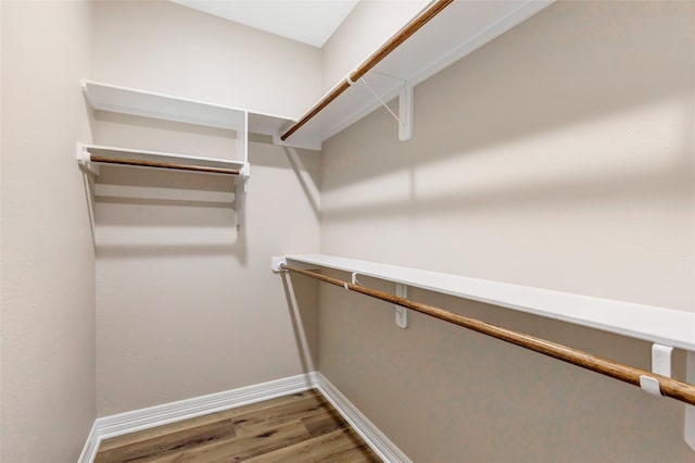 walk in closet featuring hardwood / wood-style floors