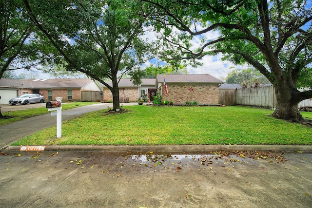 ranch-style house featuring a front lawn