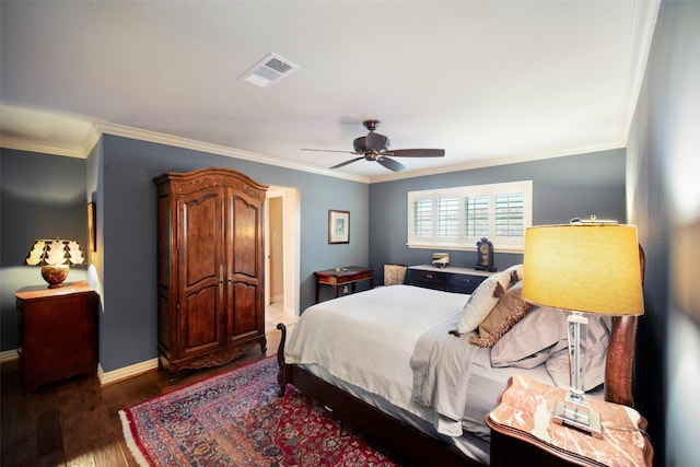 bedroom with ceiling fan, dark hardwood / wood-style flooring, and ornamental molding