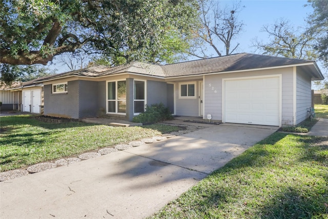 single story home featuring a front lawn and a garage