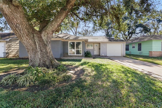 single story home featuring a front yard and a garage