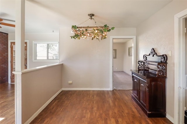 corridor featuring dark hardwood / wood-style flooring