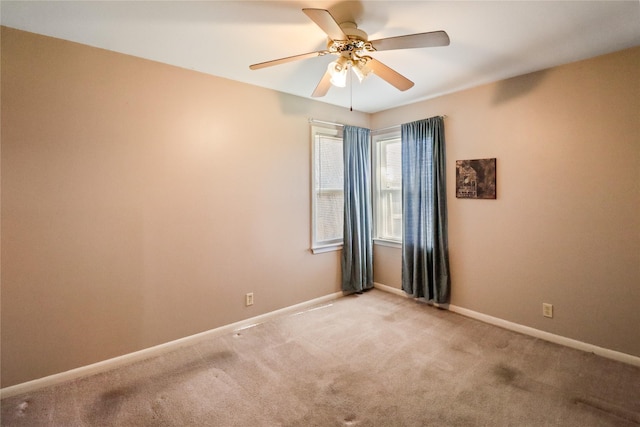 carpeted empty room with ceiling fan