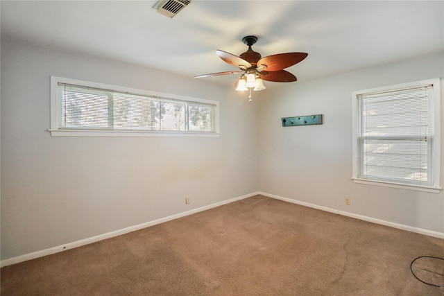 unfurnished room featuring carpet and ceiling fan