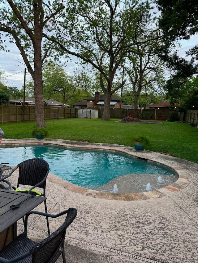 view of swimming pool featuring a patio and a lawn