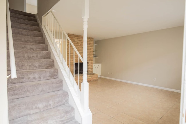 stairs with tile patterned flooring