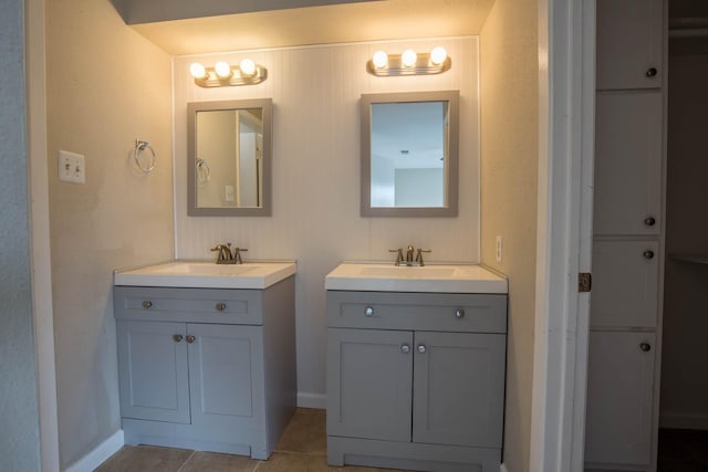 bathroom with tile patterned floors and vanity