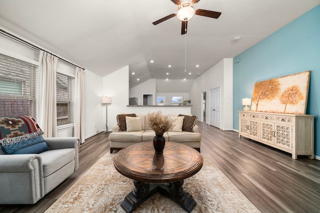 living room with ceiling fan, dark hardwood / wood-style flooring, and lofted ceiling