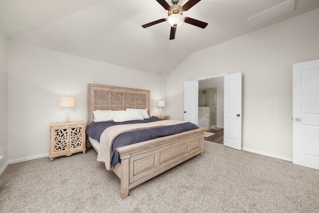 bedroom featuring connected bathroom, ceiling fan, light colored carpet, and lofted ceiling