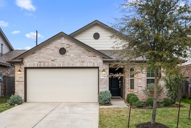 view of front facade featuring a front yard and a garage