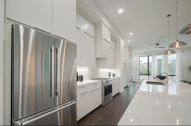 kitchen featuring sink, white cabinetry, and stainless steel appliances