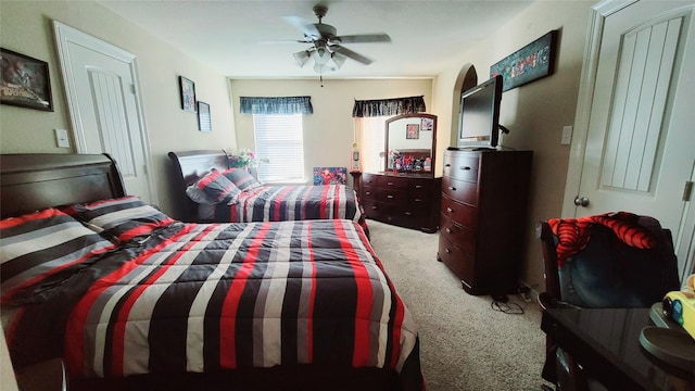 bedroom with light colored carpet and ceiling fan