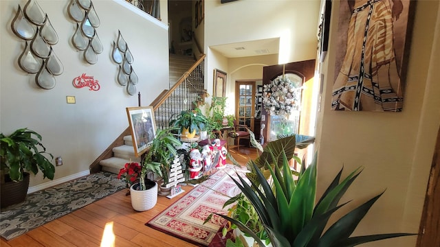 stairway featuring wood-type flooring