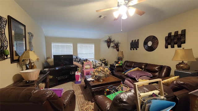 living room with ceiling fan and lofted ceiling