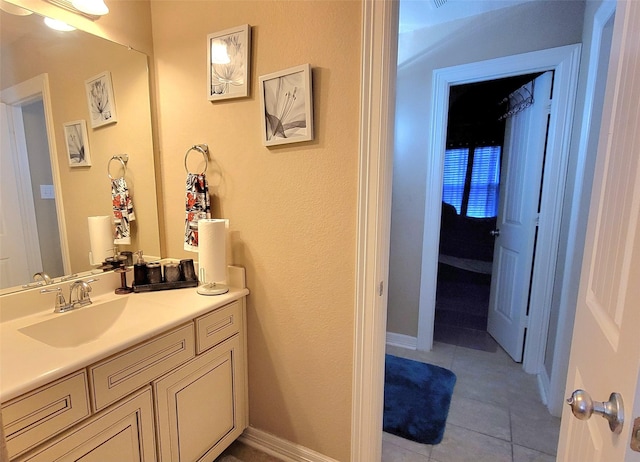 bathroom with tile patterned flooring and vanity