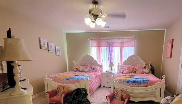 bedroom with ceiling fan and light carpet