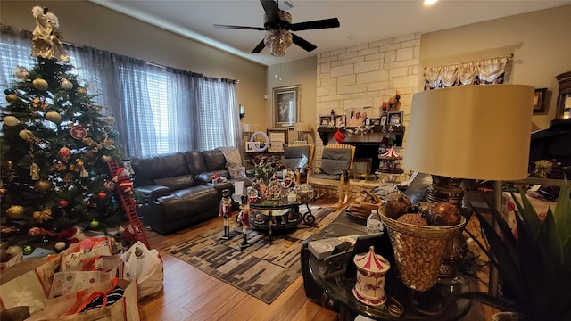 living room featuring hardwood / wood-style flooring and ceiling fan