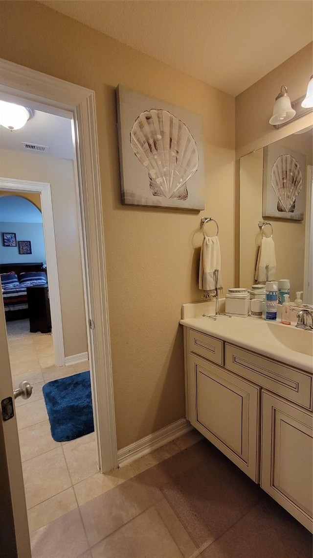 bathroom featuring tile patterned floors and vanity