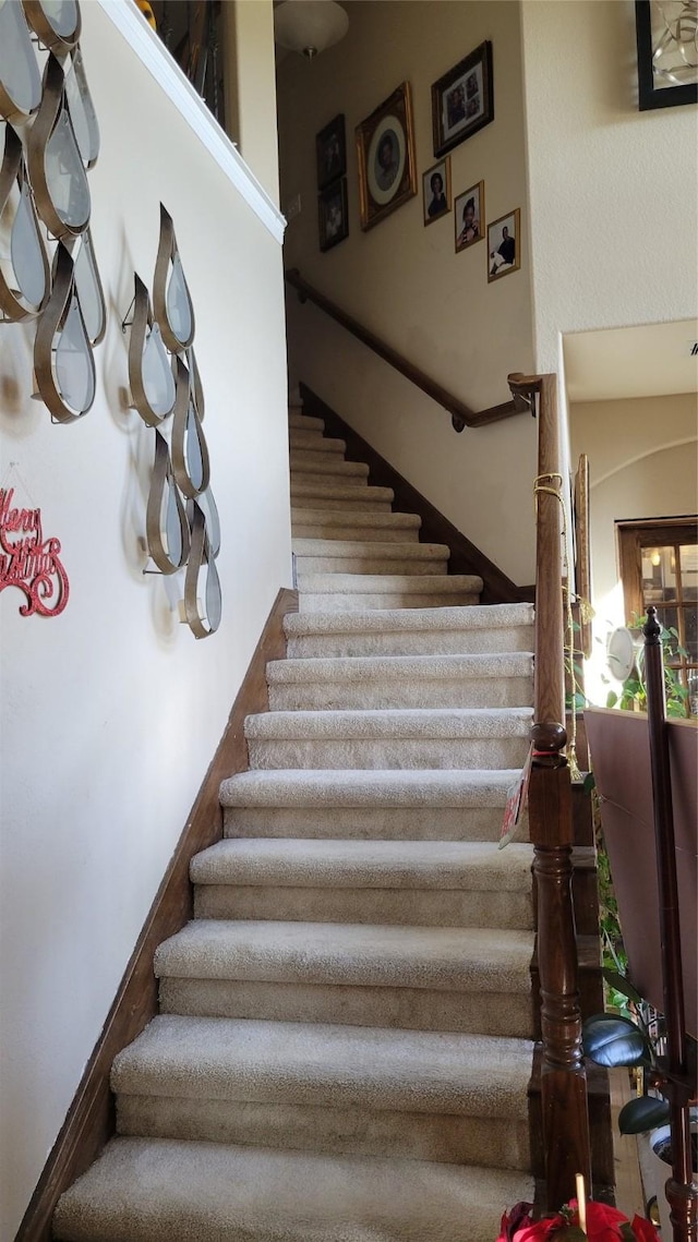 staircase with a high ceiling