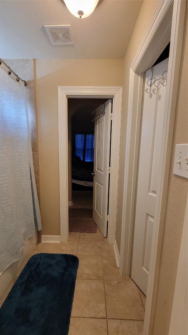 bathroom featuring tile patterned flooring