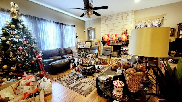 living room featuring wood-type flooring and ceiling fan