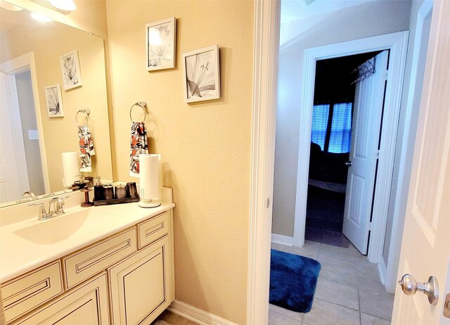 bathroom with vanity and tile patterned flooring