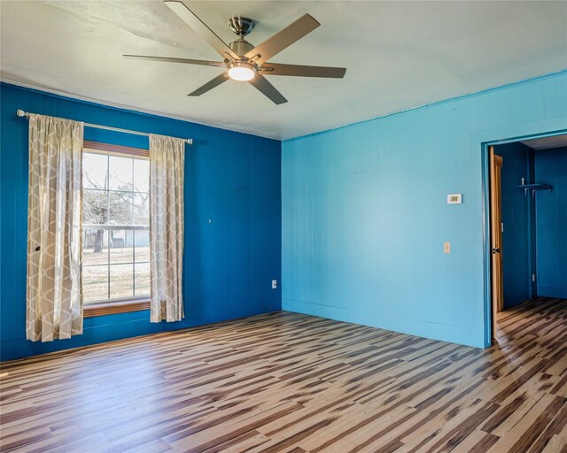 spare room with ceiling fan and hardwood / wood-style floors