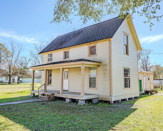 view of front of house featuring a front lawn and a porch