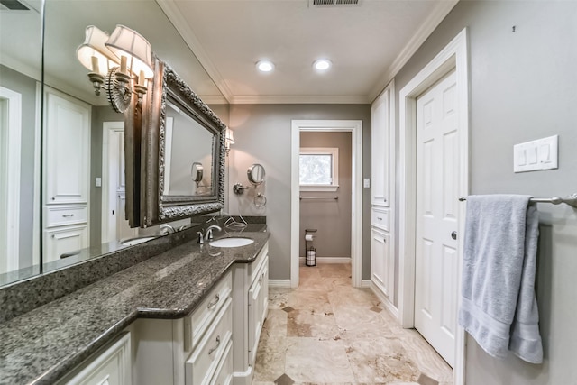 bathroom featuring vanity and crown molding