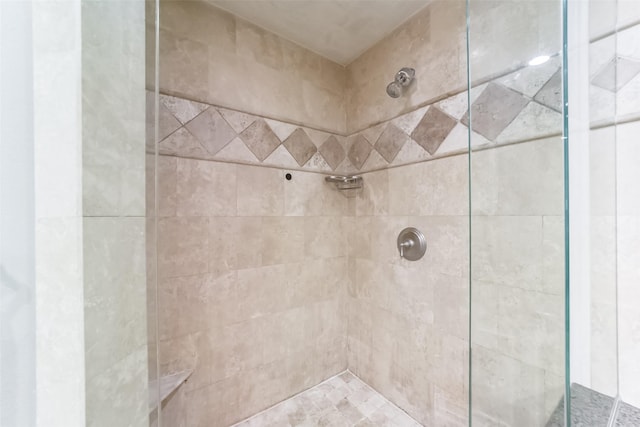 bathroom with a tile shower