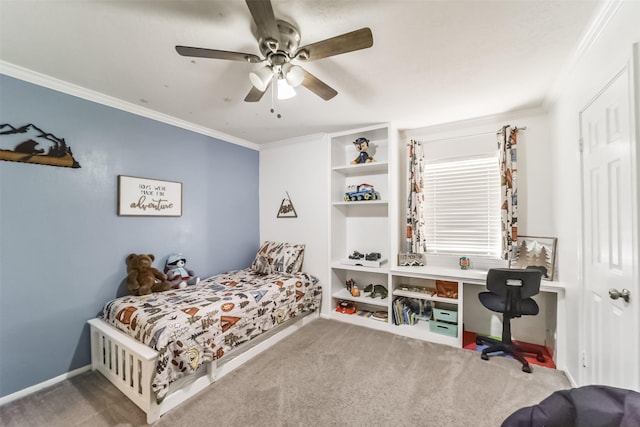 carpeted bedroom with ornamental molding and ceiling fan