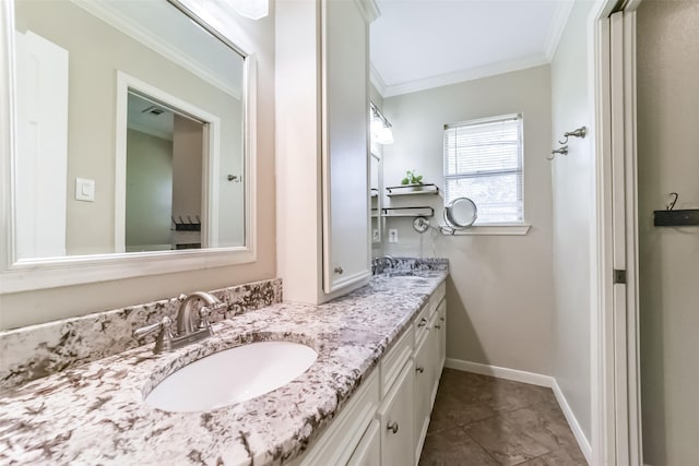 bathroom with ornamental molding, tile patterned flooring, and vanity