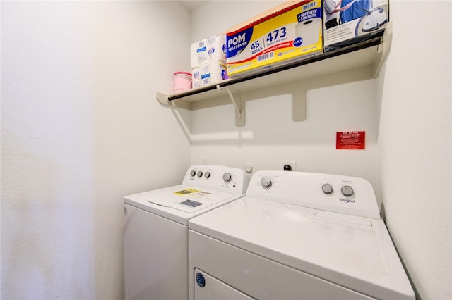 clothes washing area featuring independent washer and dryer