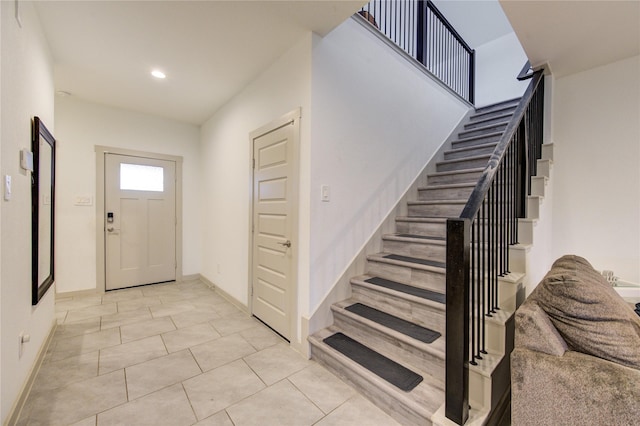 foyer featuring light tile patterned floors