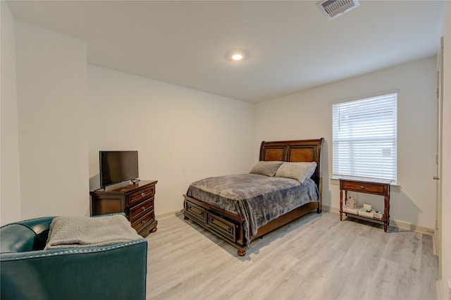 bedroom with light hardwood / wood-style floors