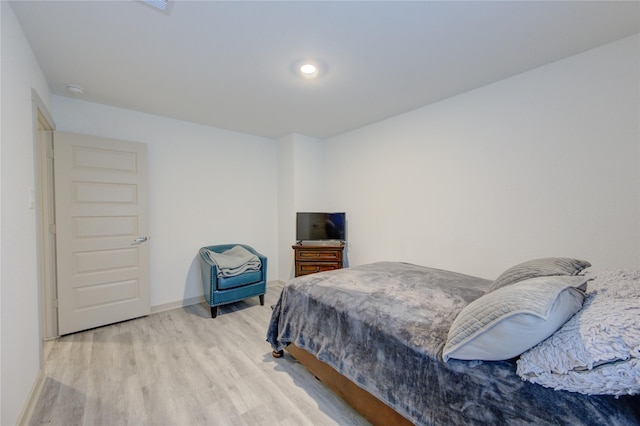 bedroom with light hardwood / wood-style flooring