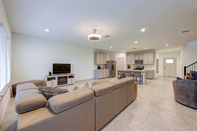 living room with light tile patterned floors