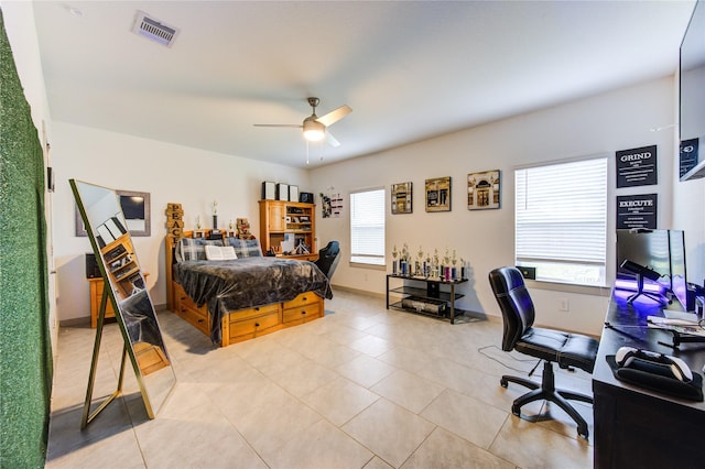 bedroom featuring ceiling fan and light tile patterned floors