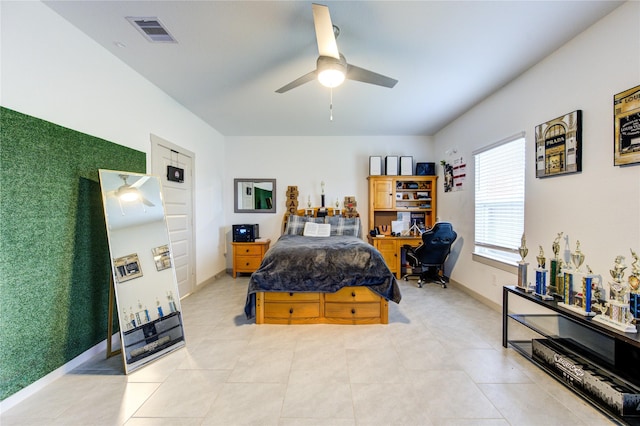 tiled bedroom with ceiling fan