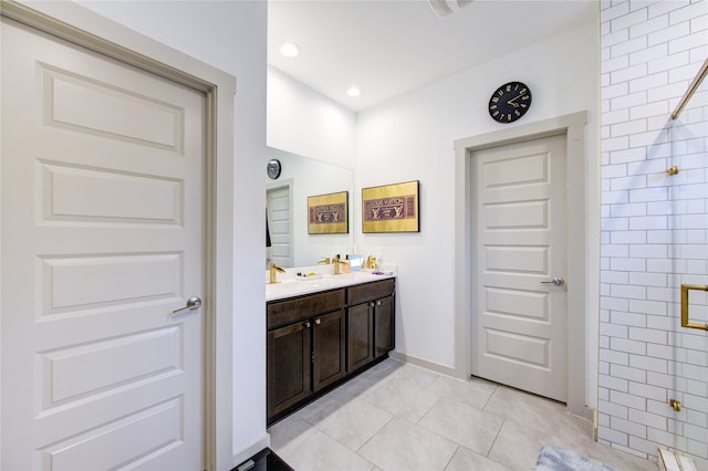 bathroom with tile patterned flooring, vanity, and an enclosed shower