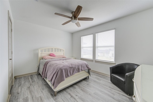 bedroom featuring ceiling fan and light wood-type flooring