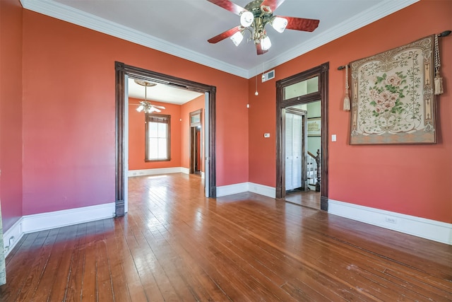 unfurnished room featuring ceiling fan, ornamental molding, and hardwood / wood-style flooring