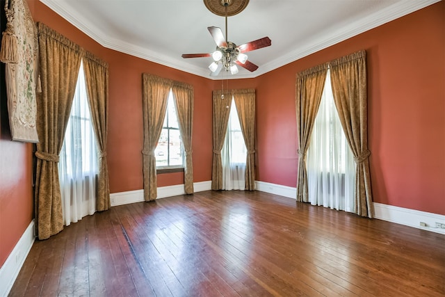 spare room featuring ceiling fan, wood-type flooring, and crown molding