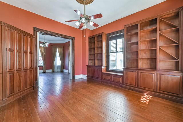 unfurnished living room with hardwood / wood-style floors and ceiling fan