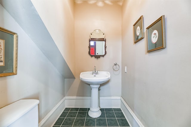 bathroom with tile patterned flooring and toilet