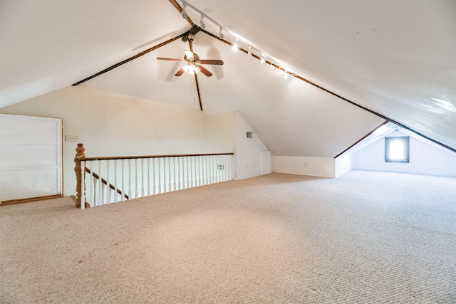 bonus room with ceiling fan, carpet, and vaulted ceiling